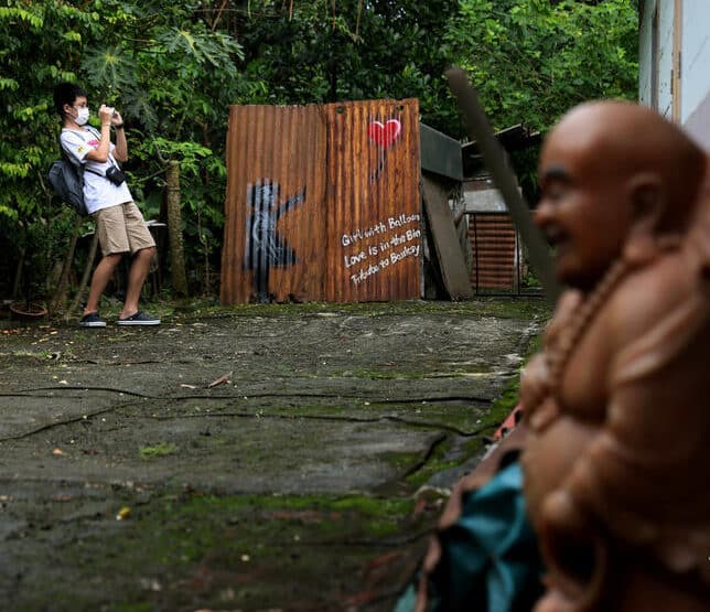 Singaporean kampongs thrive with tourists