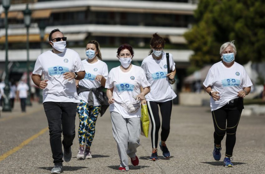 Greek doctors, masks on, off on a jog to knock wind out of critic claims