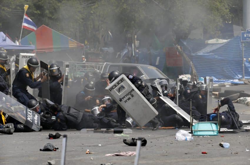 Thai police clash with protestors as royal motorcade passes by