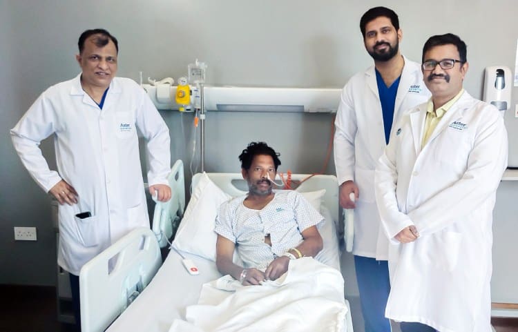 Doctors Debrabata Dash, Naveed Ahmed, and Senthilnathan TT with P Shajikuttan at Aster Hospital, Mankhool