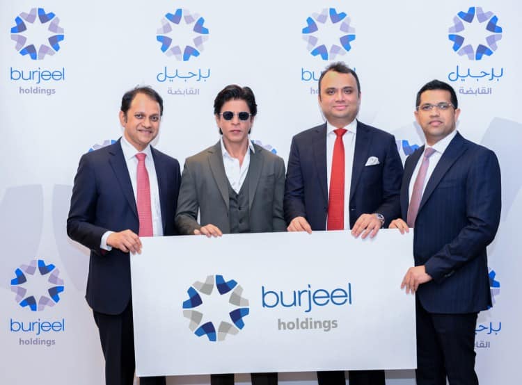 Burjeel Holdings' senior management officials with Mr. Shah Rukh Khan during the signing ceremony held in Abu Dhabi